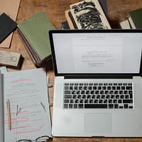 An image of a laptop showing a manuscript edit being done digitally