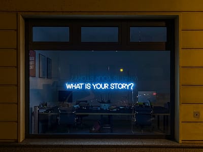 'What is Your Story?' words on a window