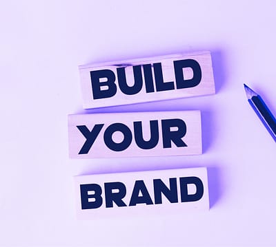 The words "build your brand" on a blue background